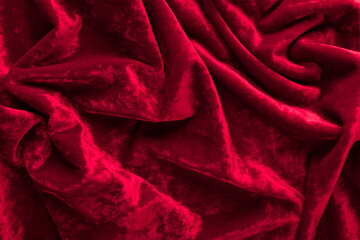 red velvet fabric texture, background. folds close up. Trendy Samba color winter 2020-2021