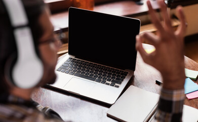 Guy At Laptop Gesturing Okay To Empty Computer Screen Indoor