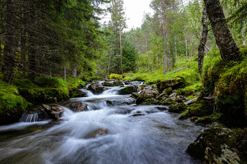 Stream of a creek with cascades