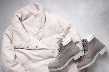 gray eco-friendly leather jacket and suede boots. Autumn, winter women's clothing fashion concept. flat lay. copy space