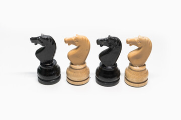 wood figurine chess piece horse white background