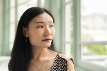 Chinese woman inside a room near windows