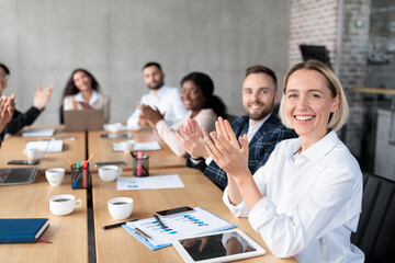 Successful Business People Applauding Celebrating Success In Modern Office