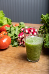 Varied organic vegetable harvest on a wooden kitchen table
