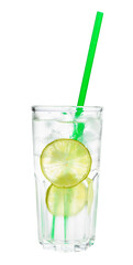 side view of gin and tonic cocktail in highball glass with two slices of lime, ice and green plastic straw isolated on white background