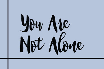 You Are Not Alone Cursive Calligraphy Black Color Text On Golden Grey Background