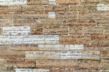 Fence on a brick facade of building tile background