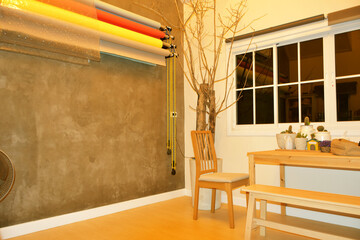 Modern chair and table made from wooden in living room with have small cactus tree on table for decor with minimal lifestyle.