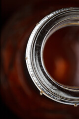 Bottle. Close-up view of Brown Bottle, focus on the Rim.