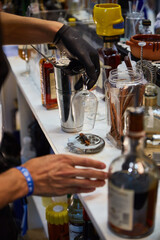photograph of bartender making a cocktail