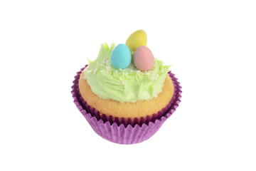  isolated easter cupcake with coconut frosting and mini chocolate eggs