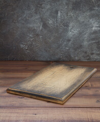 cutting board at wooden table