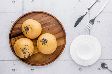 Red bean bread with empty cup of coffee