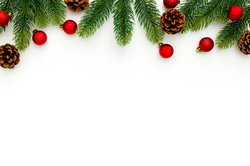 Spruce branch, cones and vintage toys decoration on christmas or new year on white background .