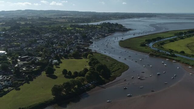 Morning aerial over the village of Topsham. The river Exe is busy with moored boats of all sizes