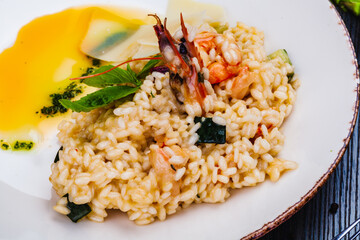 Risotto with seafood on white plate.