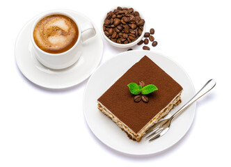 Traditional Italian Tiramisu dessert square portion on ceramic plate and cup of fresh espresso coffee isolated on white background with clipping path
