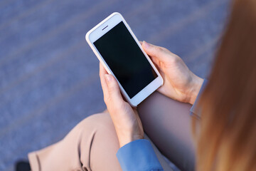Close up woman hands holding smartphone with black screen