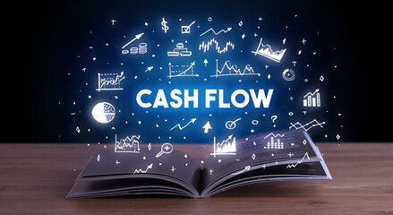 CASH FLOW inscription coming out from an open book, business concept