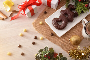 Shaped chocolate cookies and infusion on table top view