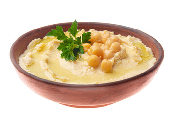 Hummus made of cooked, mashed chickpeas topped with beans and green coriander leaves isolated on white background. Clipping path added