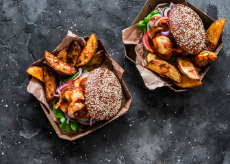 Tomato sauce meatballs mozzarella wholegrain buns burgers and baked potatoes on a dark background,...