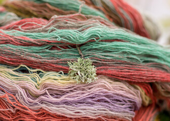 colored wool yarn skeins on a fuzzy background, handicraft concept, hand knitting, autumn time, handicrafts