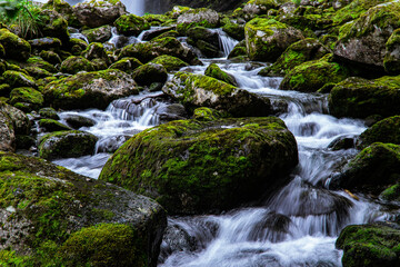 Water over stones near a waterfall