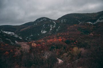 A winding road heading to a beautiful mountain range 