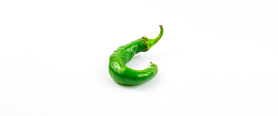 Beautiful unique green pepper of interesting shape, photo on a white isolated background banner