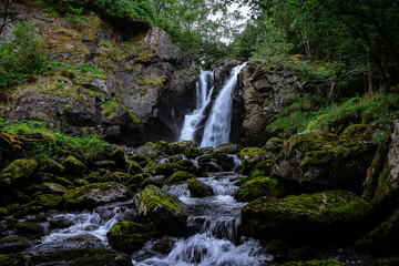 Fototapeta na wymiar Double waterfall in a forest
