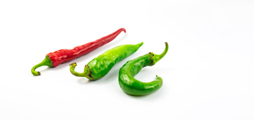 Banner photo red and green peppers pungency comparison on white isolated background