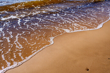 sea shore in summer beach with blue water waves and sand