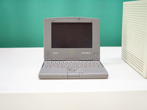 TERRASSA, SPAIN-AUGUST 9, 2020: 1992 Apple Macintosh PowerBook Duo 210 portable notebook personal computer in the National Museum of Science and Technology of Catalonia