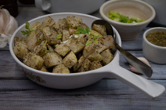 Roasted Kohlrabi In Air Fryer With Olive Oil And Mixed Herbs In White Serving Dish