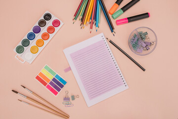 School and office supplies. background with colorful school items and stationery collection on pink background. Back to school concept