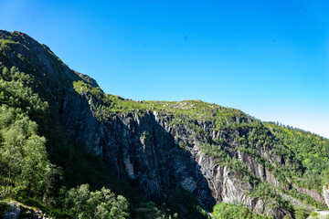 Rock massive with green trees