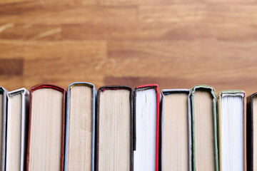 There are books in row on table. Library and archive of unique books concept
