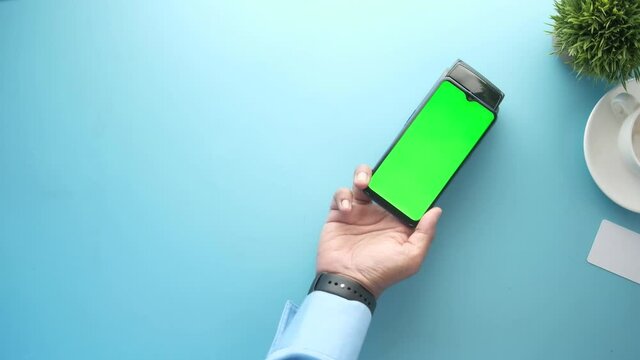 contact less payment concept with person hand paying smart phone 