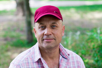 portrait of a middle aged man wearing a cap