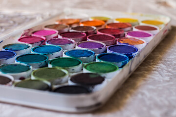 Children's watercolor box on a light background