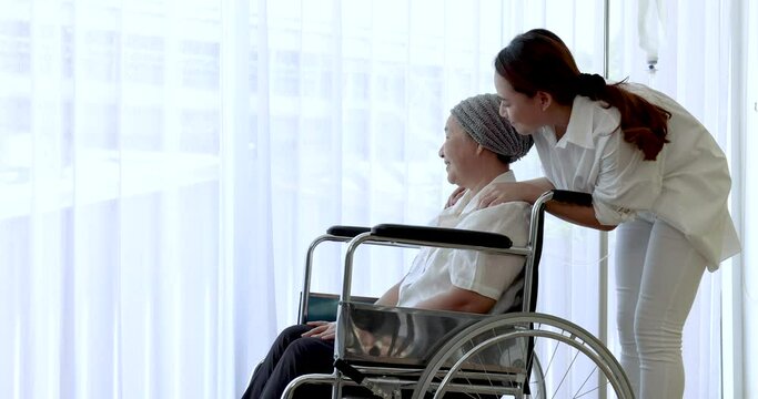 Senior disabled patient who is happy with a friendly female care worker, Take care and encourage the sick.