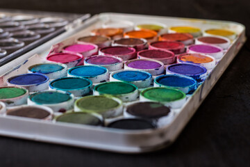 Watercolor box for babies on a dark background