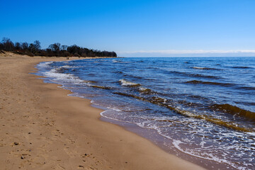 sea shore in summer beach with blue water waves and sand