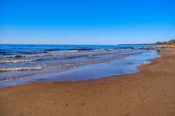 sea shore in summer beach with blue water waves and sand