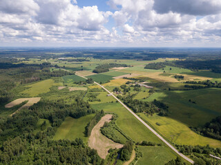 Fototapeta na wymiar countryside aerial landscape with roads and green fields in summer