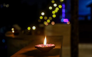 Colorful and sparkling clay diya lamps ready for decorating or illuminating house on diwali, a festival of light. 