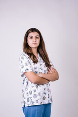 profile portrait of a nursing assistant on a white background with her arms crossed