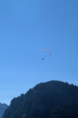 paraglider in the mountains, star, sunlight, bright, space,freedom, glider, air, gliding, mountain, adventure,  