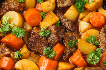 Beef Stew with carrot and baby potato in iron cast pan